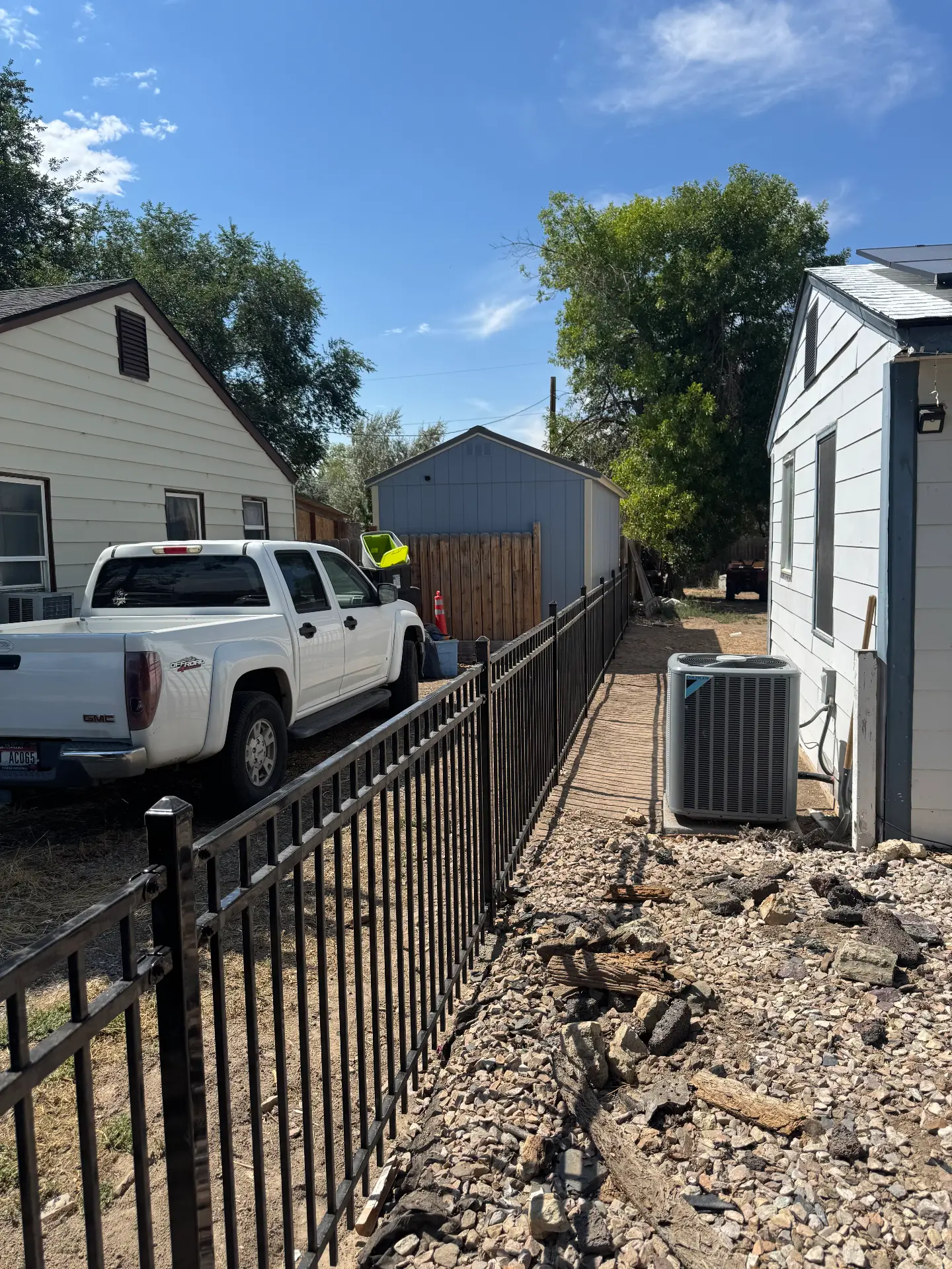 Black ornamental iron fence along a home and landscaping — R & R Construction, Burley Idaho