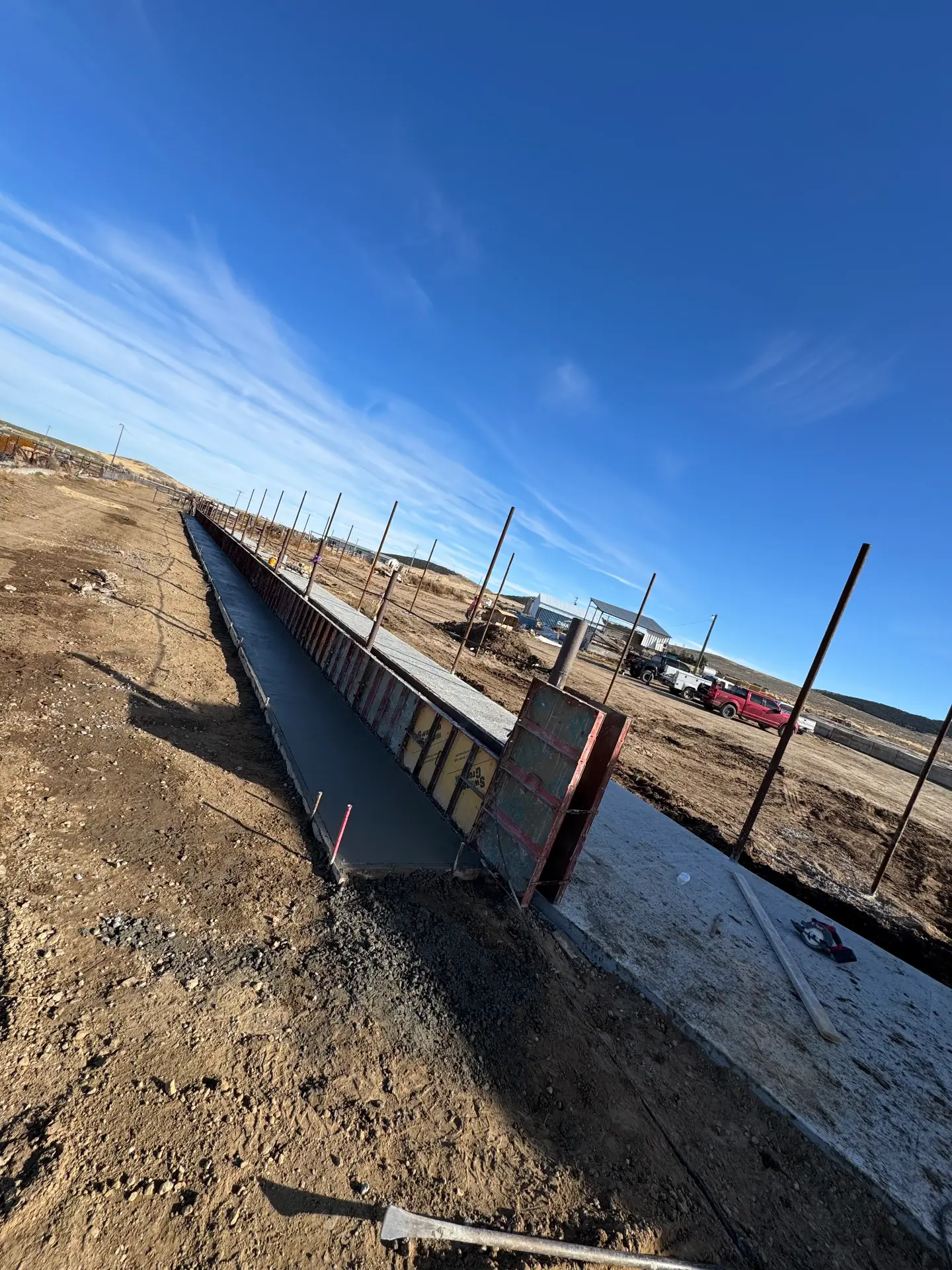 Long concrete wall formed and poured on a prepared site — R & R Construction, Burley Idaho
