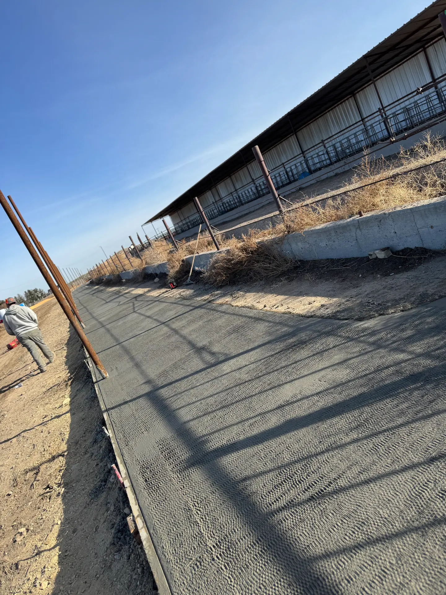 Freshly broom-finished concrete walkway — R & R Construction, Burley Idaho