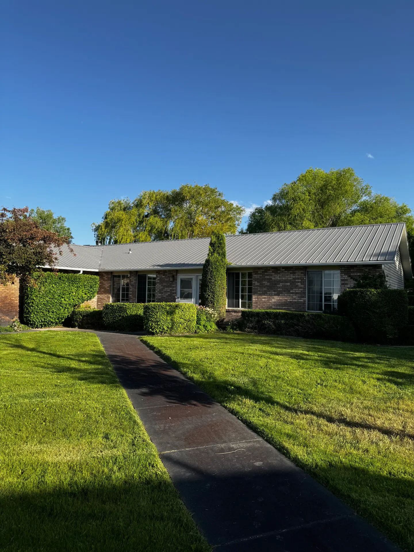 Neatly trimmed residential lawn and walkway — R & R Lawncare, Burley Idaho